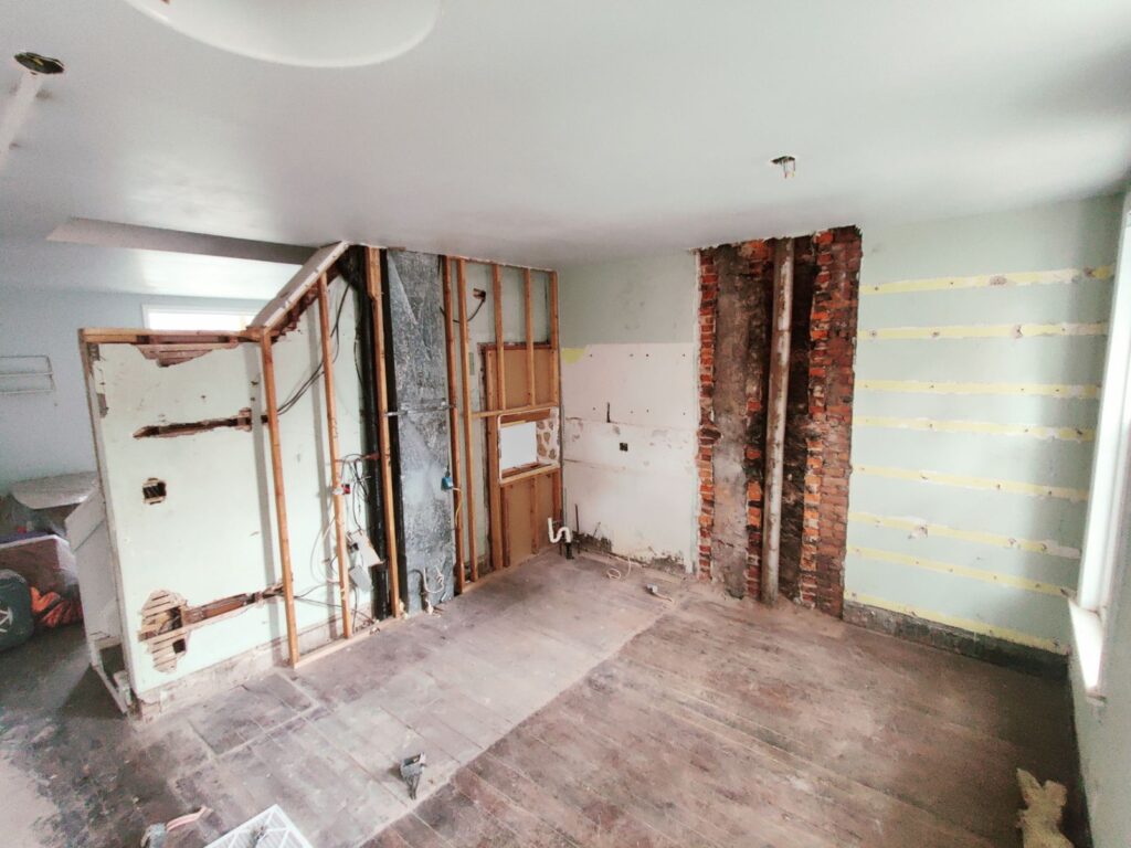 a view of the kitchen during construction with all cabinets and finished removed